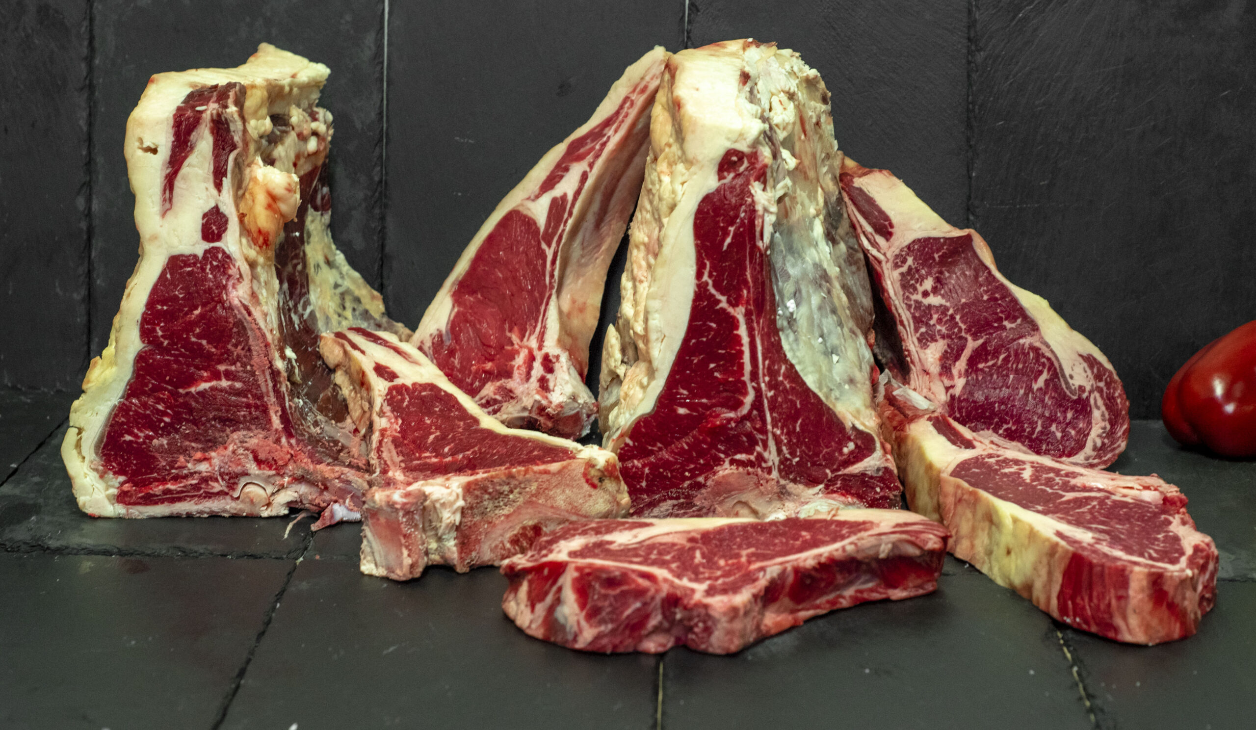 Showcasing our renowned dry-aged biological beef. These beautifully marbled cuts are aged to perfection, delivering exceptional flavor and tenderness. A specialty of the Paterakis family since 1924.